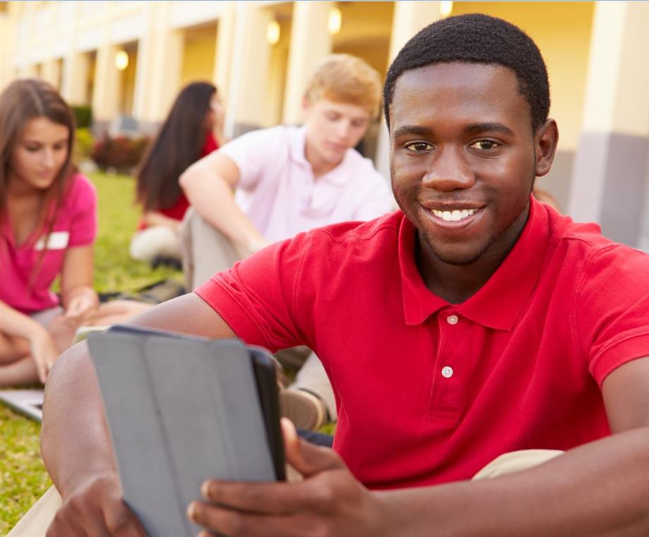  Male student holding a tablet