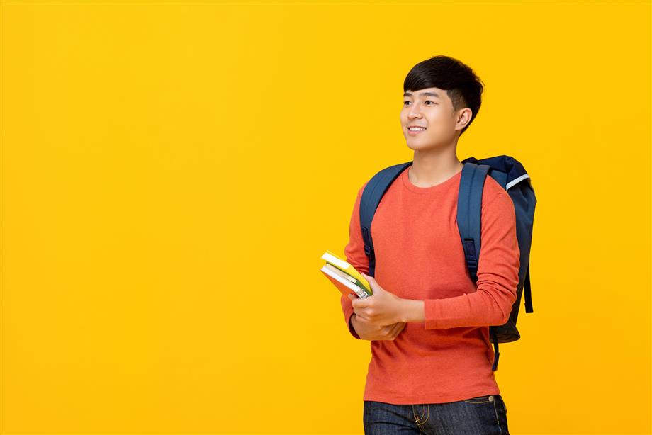 High school student holding books